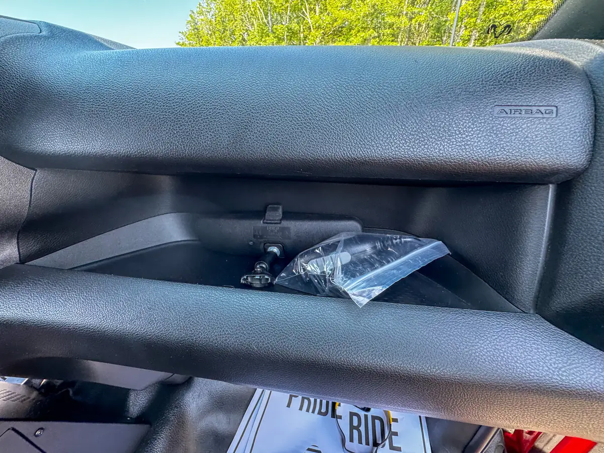 Center console close-up showing mounted control pads and adjacent switches.